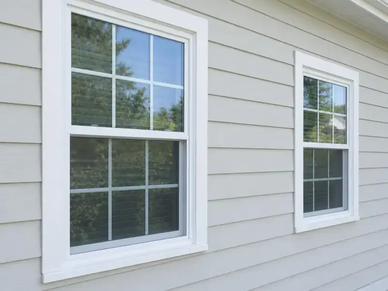 Clean light siding and windows on a home in Cary, IL